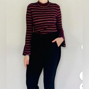 Trina Turk striped turtleneck size Small. Fitted body with bell cuff.